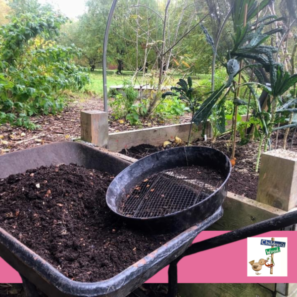 A wheelbarrow with compost and a sieve. Logo is of the Children's Wood A wheelbarrow with compost and a sieve. Logo is of the Children's Wood